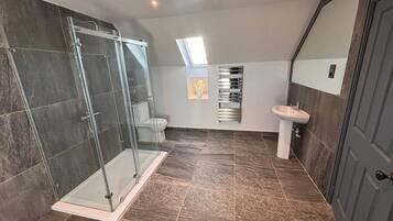 Shower, hair dryer, towels, soap