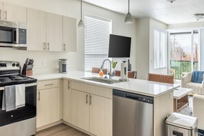 Fridge, dining tables - Landing | Stunning 2BD, Gym, Rooftop Lounge (Salt Lake City)
