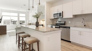 Fridge, dining tables - Landing | Spectacular 1BD, Clubhouse, Gym (Longmont)
