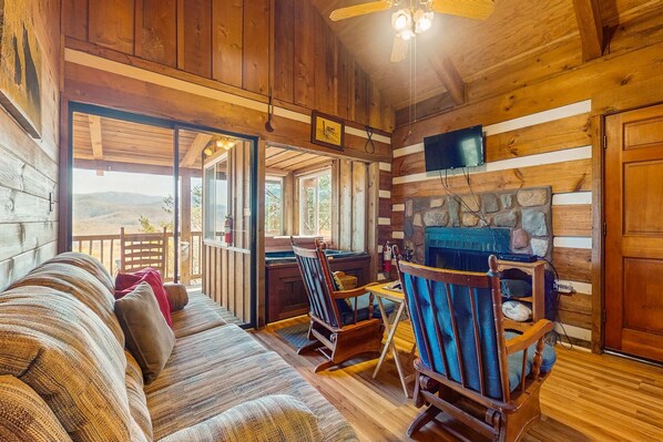 Living area - Cozy log cabin w/ Free Attraction TIckets, private hot tub, fireplace, & deck (Townsend)