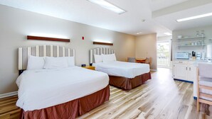A hotel room with two beds, a kitchenette, and a view of the outdoors. - Studio W Quiet View, Patio, Gym, Games, Dog Friendly (Baneberry)