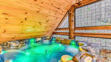 Hot Tub Paradise, unwind in a vibrant hot tub surrounded by rustic charm and nature views!