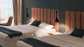 Chambre Junior avec lits jumeaux | Coffres-forts dans les chambres, Wi-Fi gratuit