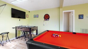 A room with a pool table, foosball table, dartboard, and a flat-screen TV. - Peaceful Studio, Sleeps 4, Gym, Near Douglas Lake (Baneberry)