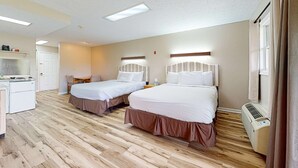 A hotel room with two beds, a kitchenette, and a ceiling fan. - Peaceful Studio, Sleeps 4, Gym, Near Douglas Lake (Baneberry)