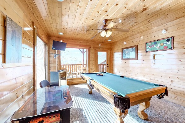 A wooden cabin with a pool table, a television, and a sign indicating a pool room. - Gorgeous Private Oasis, Sleeps 4・Scenic Deck・Games (Sevierville)