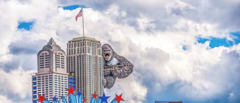 A Hollywood sign with a bear sculpture and a flag.