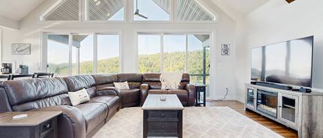 Télévision, cheminée, lecteur de DVD, baby-foot