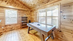A wooden room with a pool table, two windows with blinds, and a shelf with items. - Secluded Retreat, Sleeps 4・Furnished Deck・Hot Tub (Sevierville)