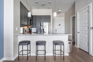 Fridge, dining tables - Landing | Chic 1BD, Courtyard, Pool (Savannah)