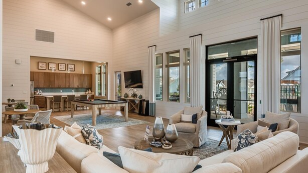 A spacious living room with a pool table, comfortable seating, and a kitchen area with wooden cabinets and a flat-screen TV. - Landing | Incredible 3BD, Yoga Studio, Gym (Four Corners)