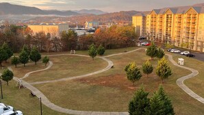 A residential area with a large apartment building, a playground, and a winding road. - 2.4 Mi. to DT Pigeon Forge Stay・Hot Tub・Grill・Pool (Pigeon Forge)