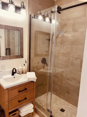 Shower, hair dryer, towels, soap