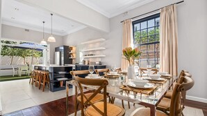 A modern kitchen with a dining area. - Bellevue House - Three Bedroom House, Sleeps 6 (Cape Town)