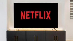 A television with the Netflix logo on a black background, mounted on a black cabinet with gold handles. - Family-Friendly Retreat, 20min to Disney & OC (Santa Ana)