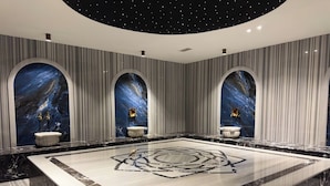 A luxurious bathroom with a large marble floor, three arched niches with decorative elements, and a starry ceiling design. - Apartment 1+1 Qoople Excellence С49 With a terrace on the 1st line of the sea (Alanya)