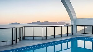 A modern pool area with a clear view of the sea and distant mountains. - SHB - Discover the Magic of a Panoramic View (Santos)