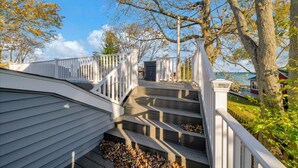 A wooden staircase with white railings leading to a deck area. - The Lakeview Lookout - Gorgeous Lake Views! (Lexington)