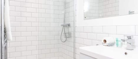 Shower, hair dryer, towels, soap