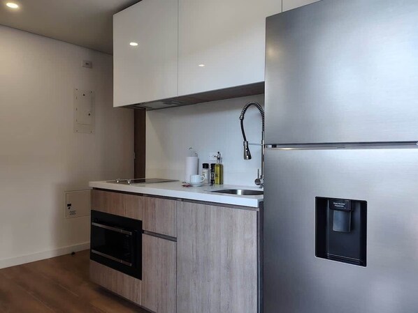 Fridge, microwave, stovetop, coffee/tea maker