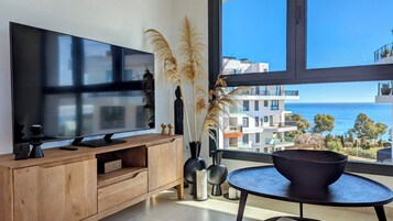 Design & Spa Apartment | Living area | 40-inch Smart TV with digital channels