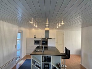 Fridge, oven, stovetop, dishwasher - Elegant home with views of protected landscape. (Blokhus)