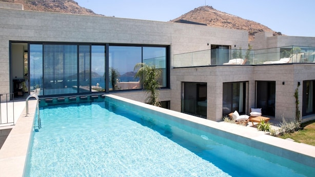 A modern pool area with a clear view of the mountains in the background. - VistaPort A (Bodrum)