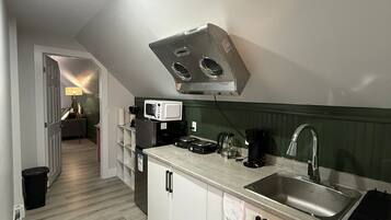 Fridge, microwave, stovetop, coffee/tea maker