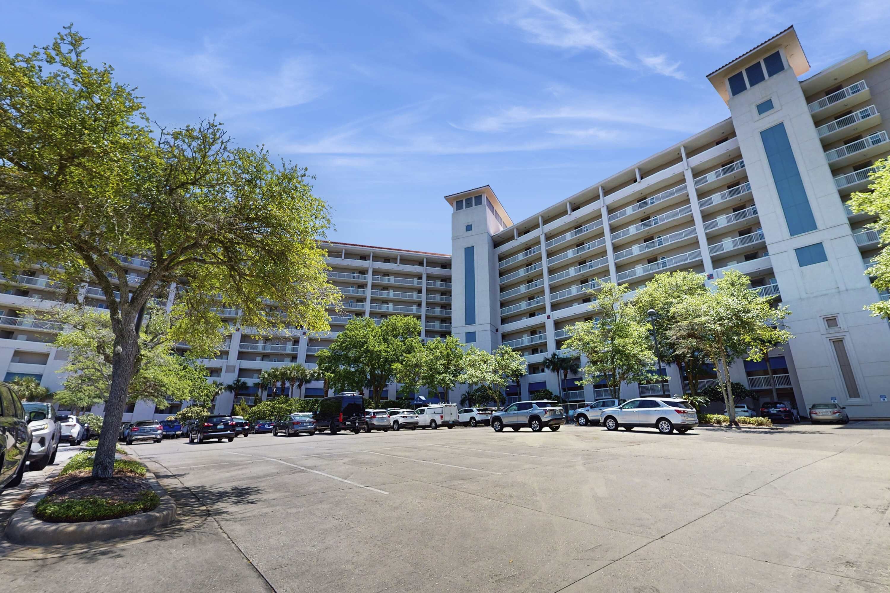 A multi-story parking garage with several cars parked.