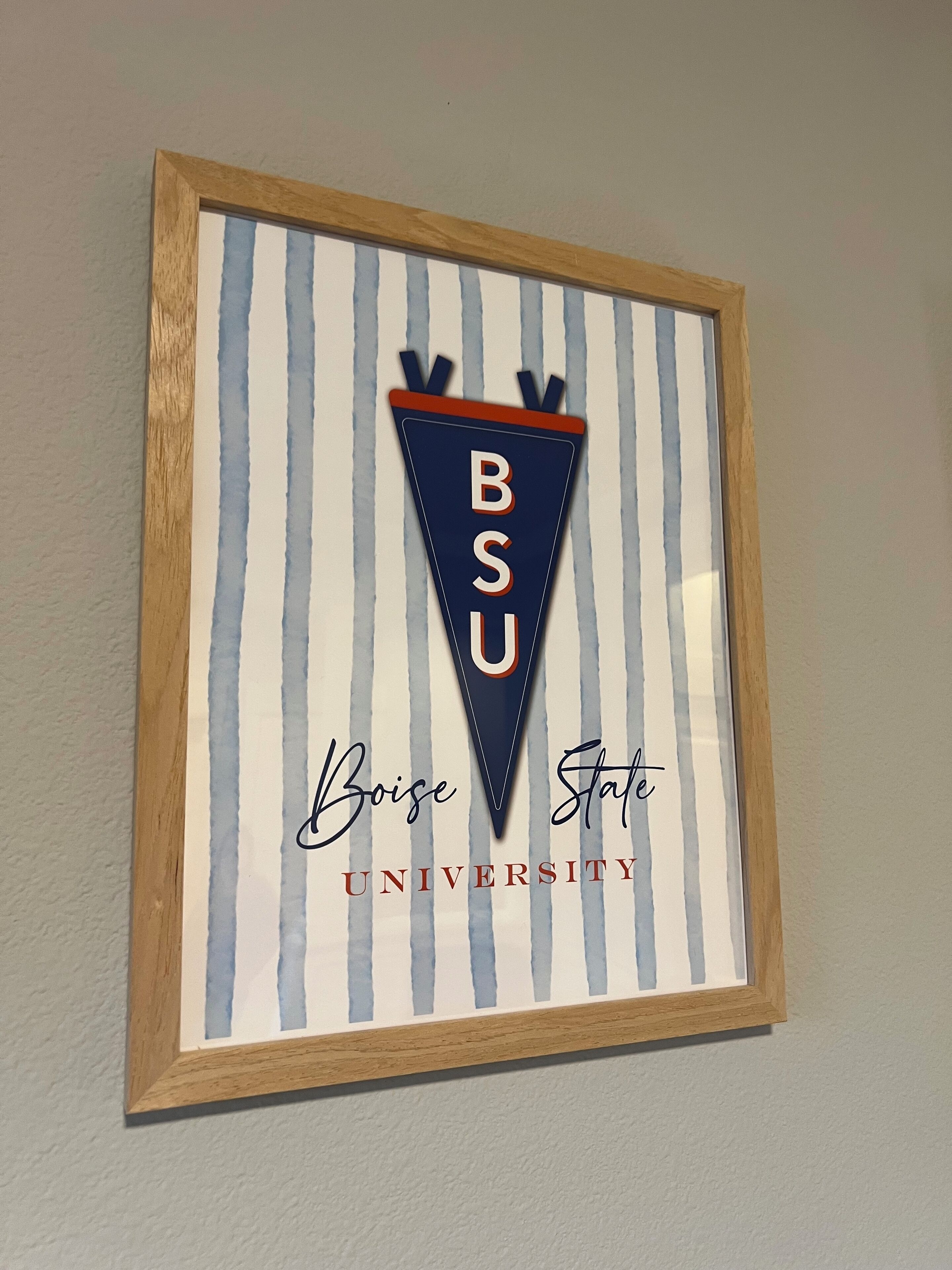 A framed sign with the Boise State University logo and name.