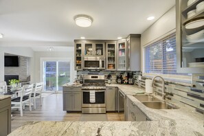 Fridge, microwave, oven, stovetop - Spacious Rockrimmon Getaway | Sleeps 14 | GameRoom (Colorado Springs)