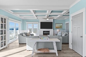 Smart TV, fireplace - Clear Skies: Spacious 7-Bedroom Oceanfront Retreat in Oak Island, NC, perfect for up to 20 guests. (Oak Island)