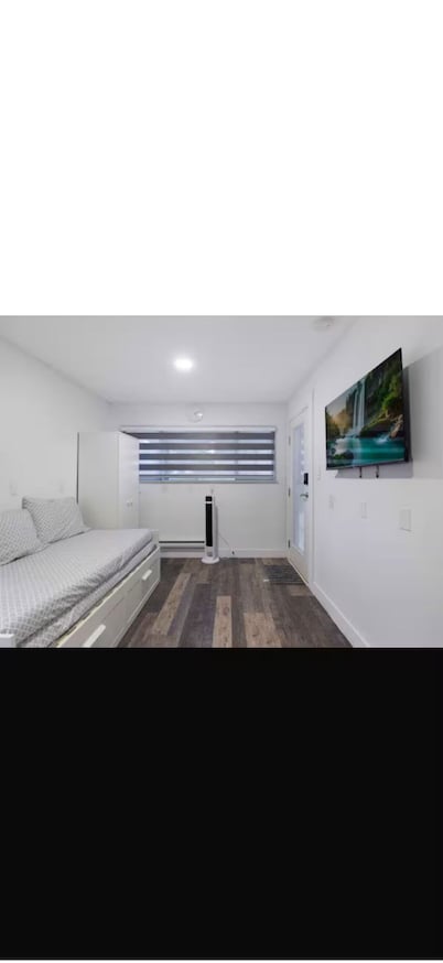 A small studio with a large backyard patio.