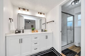 Shower, hair dryer, towels, soap