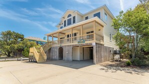 A two-story house with a covered porch, a staircase, and a sign that reads 'Southern Heights.' - Seventh Heaven - Corolla, Ocean Sands, 500 Yds to Beach, Pool, Hot Tub, Pool Table, Pets OK (Corolla)