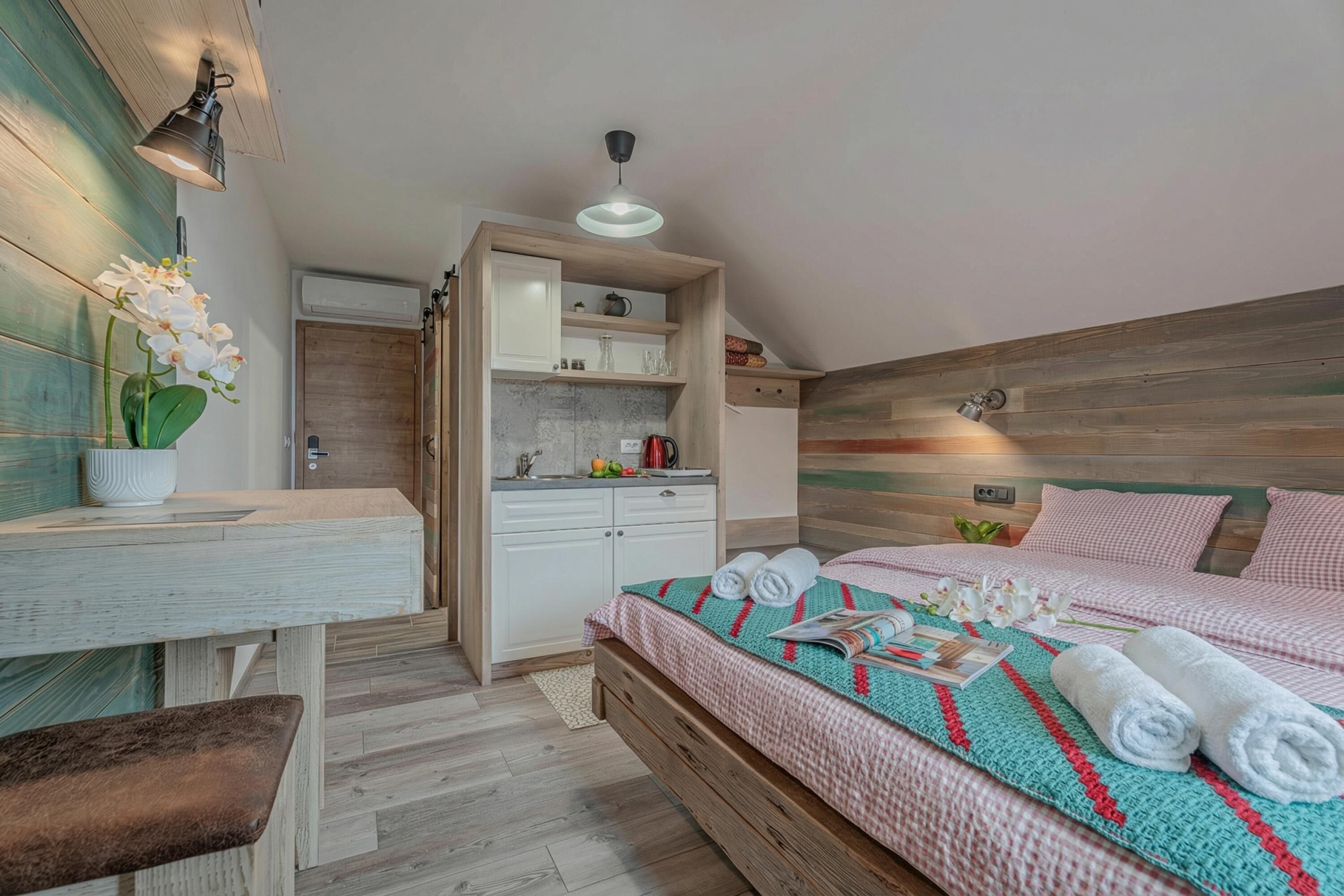 A bedroom with a bed, bedside table, and a built-in wardrobe.