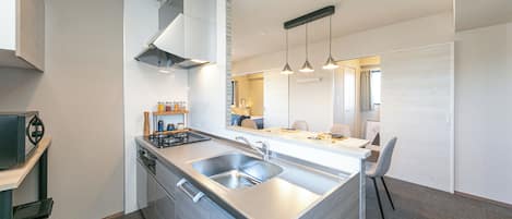 Superior Suite, Non Smoking, City View | Private kitchen | Full-size fridge, microwave, cookware/dishes/utensils, freezer