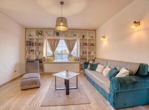 Villa (Villa Serenity with Pool) | Living room | 32-inch flat-screen TV with cable channels - Villa Serenity (Nin)