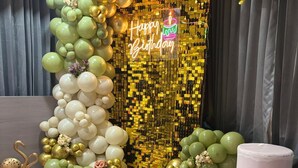A room with a disco ball, balloons, and a 'Happy Birthday' sign. - Hotel Bluzill (Vadodara)