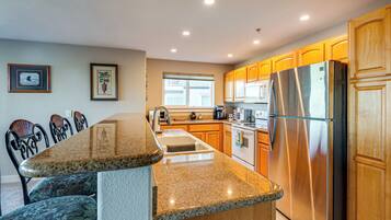 Fridge, microwave, stovetop, coffee/tea maker