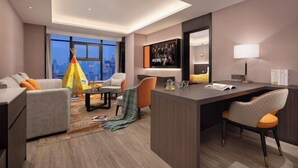 A modern hotel room with a large window, a desk, two chairs, a sofa, and a decorative teepee. - Hantang Hotel (Erqi Square Zhengzhou Railway Station East Square Branch) (Zhengzhou)