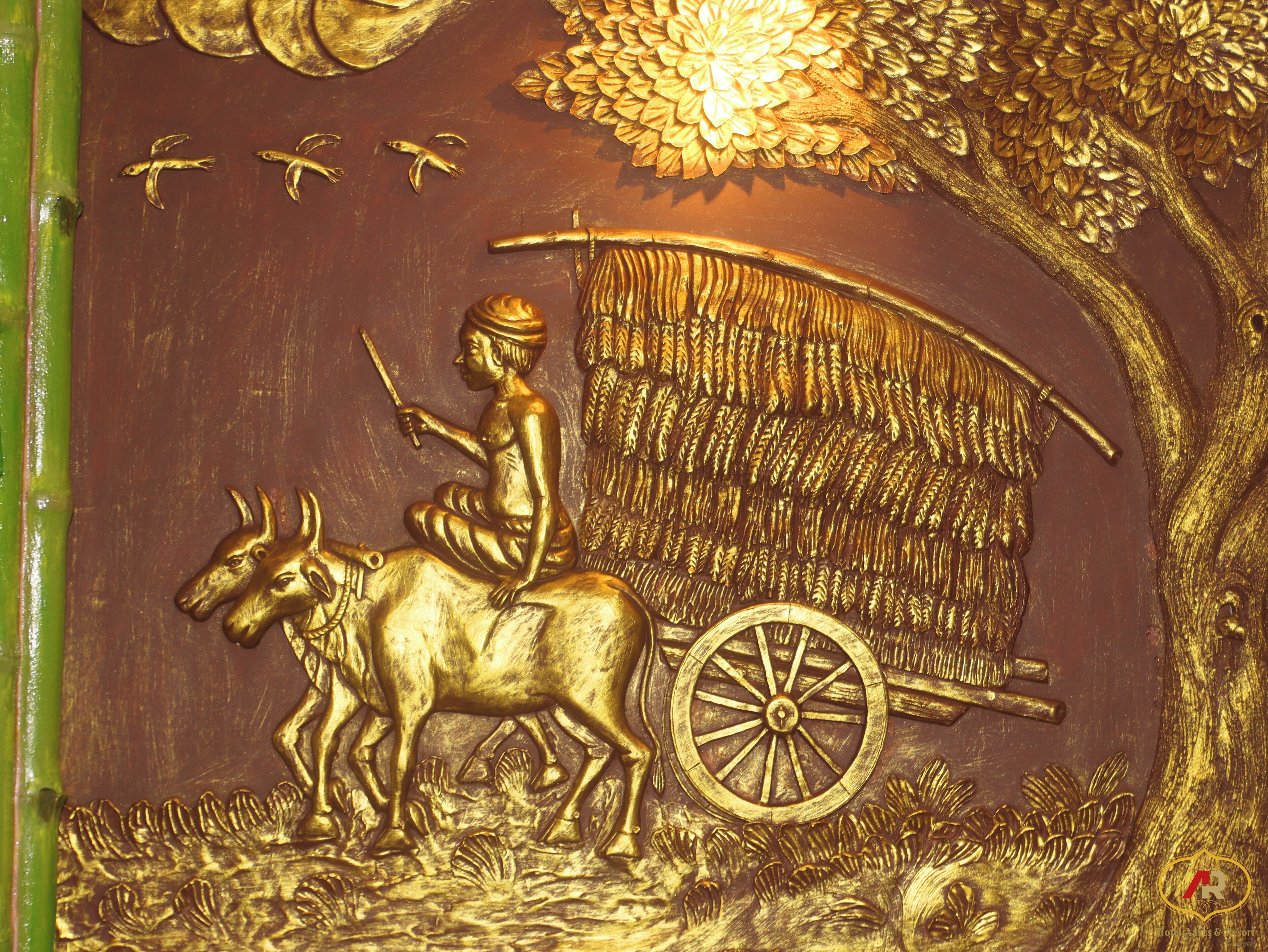A detailed relief sculpture of a man on a horse-drawn cart, surrounded by foliage and birds.