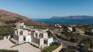 A modern villa with a pool, surrounded by natural landscape and a view of the sea. - Himmel Villa I - Private pool, seaview&playground (Chania)