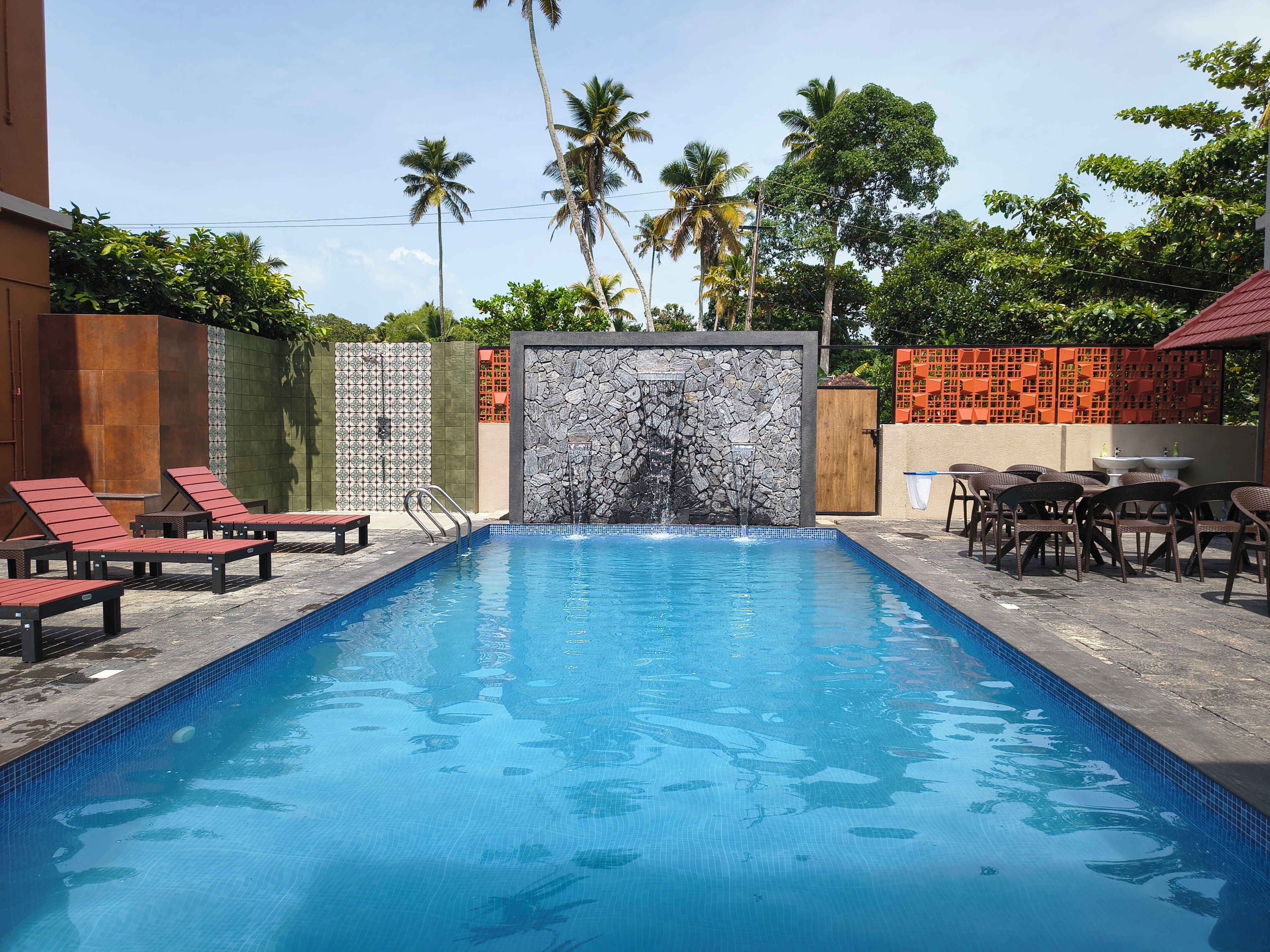 Outdoor pool, open 6:00 AM to 10:00 PM, pool umbrellas, sun loungers