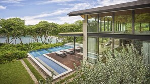 A modern house with a pool, a dining area, and a view of the water. - Four Seasons Resort Costa Rica At Peninsula Papaga (Nacascolo)