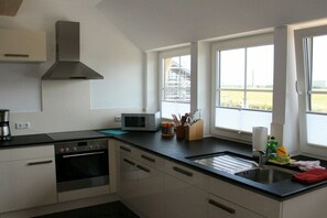 Oven, dining tables - Holiday home in Dranske with swimming pool (Dranske)