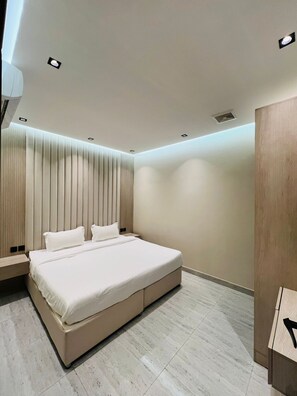 Family Studio Suite, City View | Iron/ironing board - Ras Al Hama Real Estate (Riyadh)