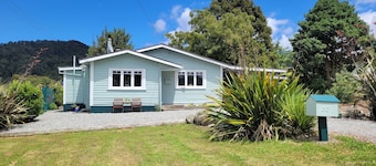 Cosie Miners cottage in historic blackball, surrounded by the Paparoa ranges
