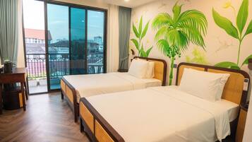 Deluxe Twin Room, Pool View | In-room safe, desk, laptop workspace, soundproofing