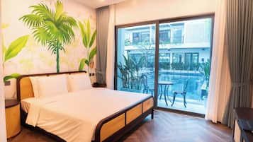 Deluxe Double Room, Pool View | In-room safe, desk, laptop workspace, soundproofing